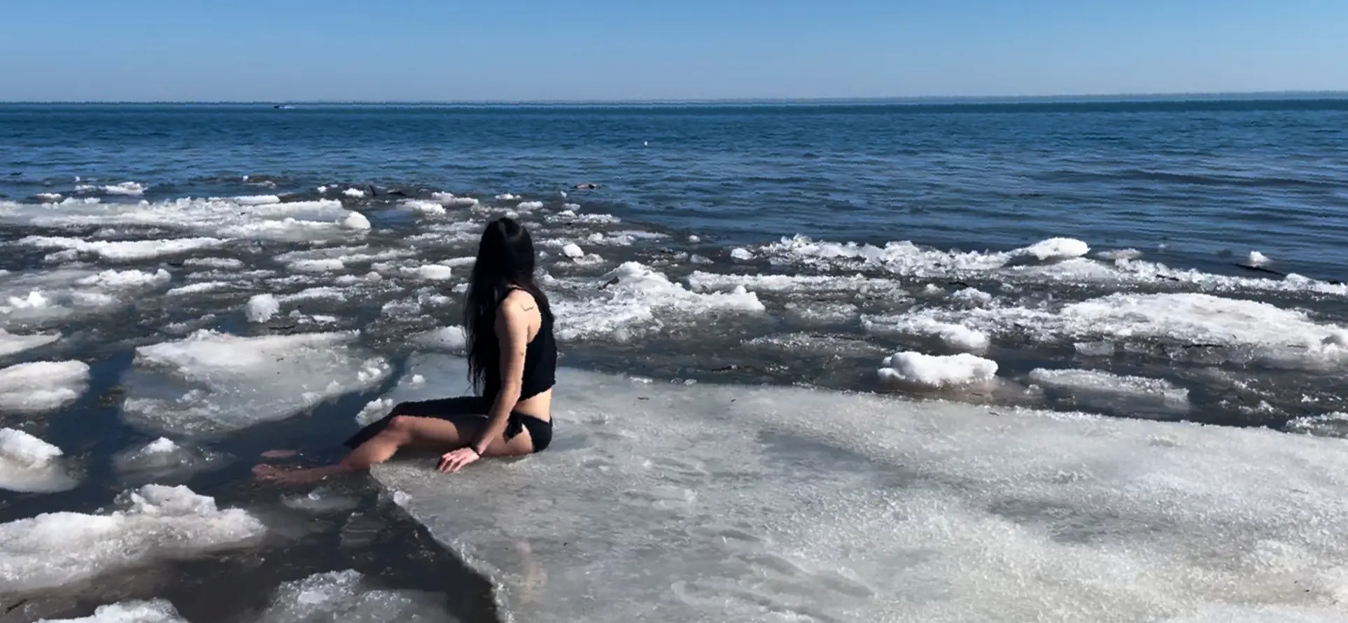 Sitting on a floating ice chunk in Lake Superior